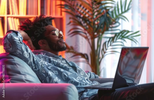 A person relaxing in front of a laptop, labour day image photo