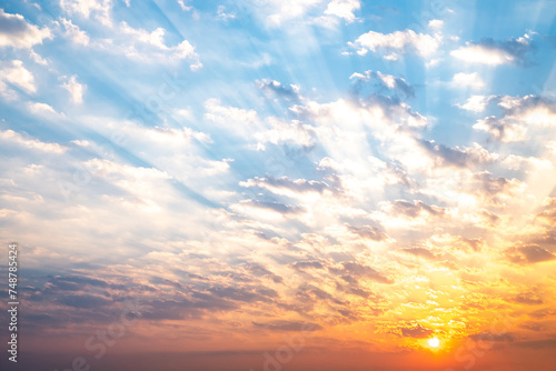 Sky, sunrise, sunset, luxury soft gradient orange gold clouds and gold sunlight between group of blue clound sky perfect for the background, take in everning,Twilight, high definition landscape photo photo