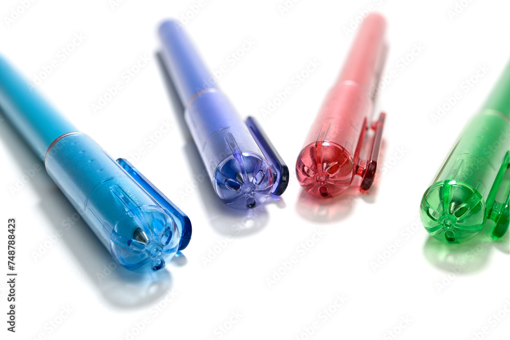 Close-up of colorful pen lids with a small hole to prevent choking
Close-up of colorful pen lids with a small hole to prevent choking