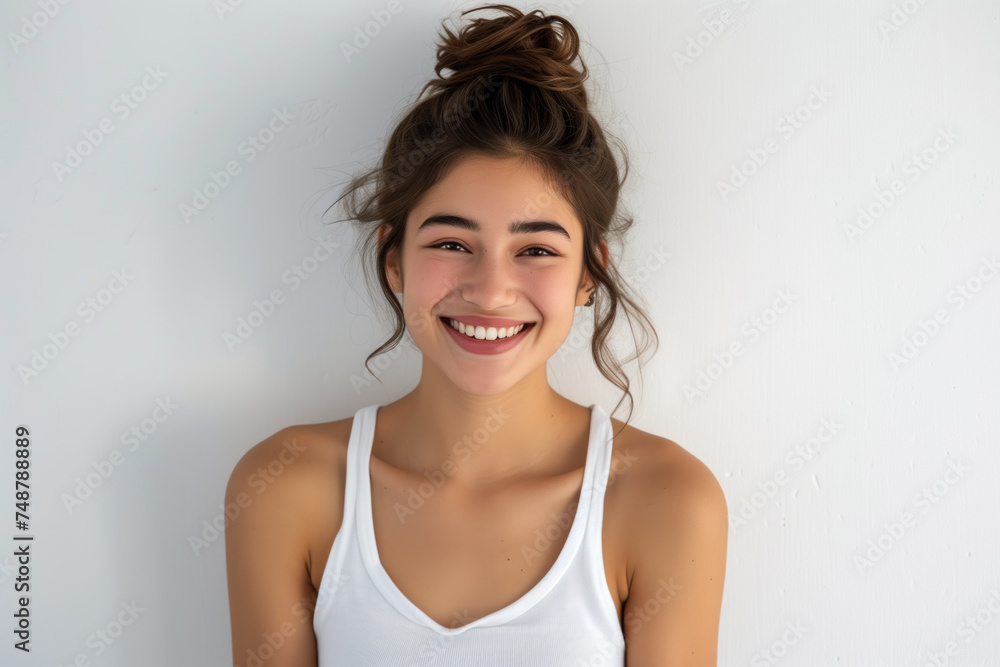 Radiant Young Woman with Messy Bun Smiling Cheerfully Radiant Young Woman with Messy Bun Smiling Cheerfully