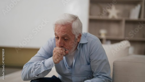 Wallpaper Mural Senior man feel bad has terrible cough. Elderly gray haired male suffering from asthma coughing fit, influenza covid-19 virus having cold sitting on couch at home. Health problems in old age concept. Torontodigital.ca
