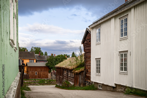 A quaint lane in Roros, where traditional Norwegian timber architecture with grass roofs. Norway © Artem