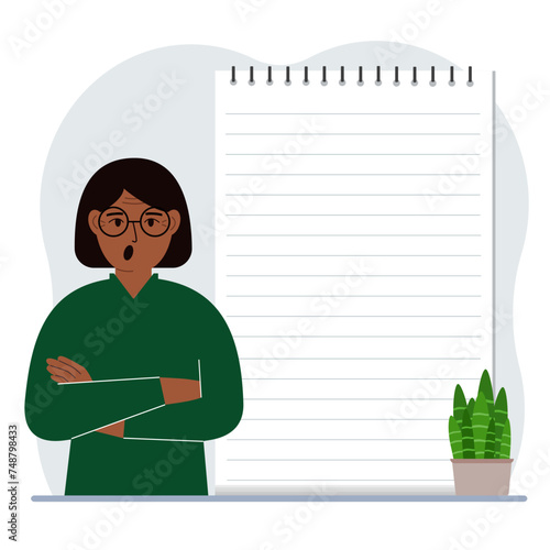 A woman next to a large notepad or large notebook. The concept of filling a notebook or notepad, writing notes, time management, planning.
