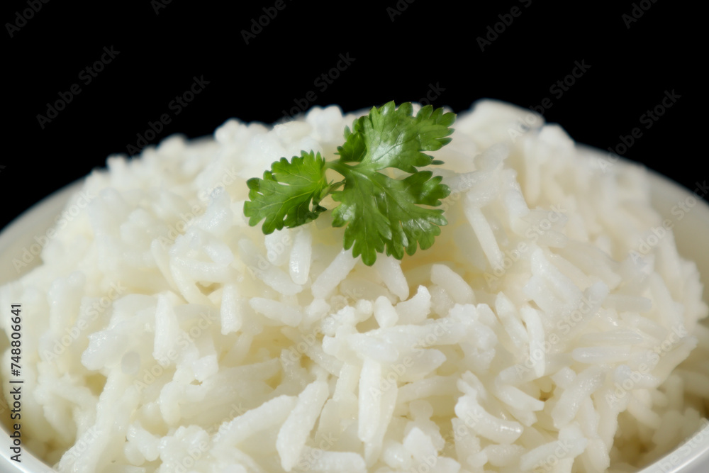 Close up, White rice in bowl, black background Close up, White rice in bowl, black background