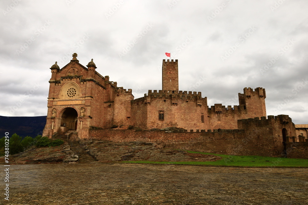 The Castle of Xavier is located on a hill in the town of Xavier , 52 km east of Pamplona and 7 km east of Sangüesa