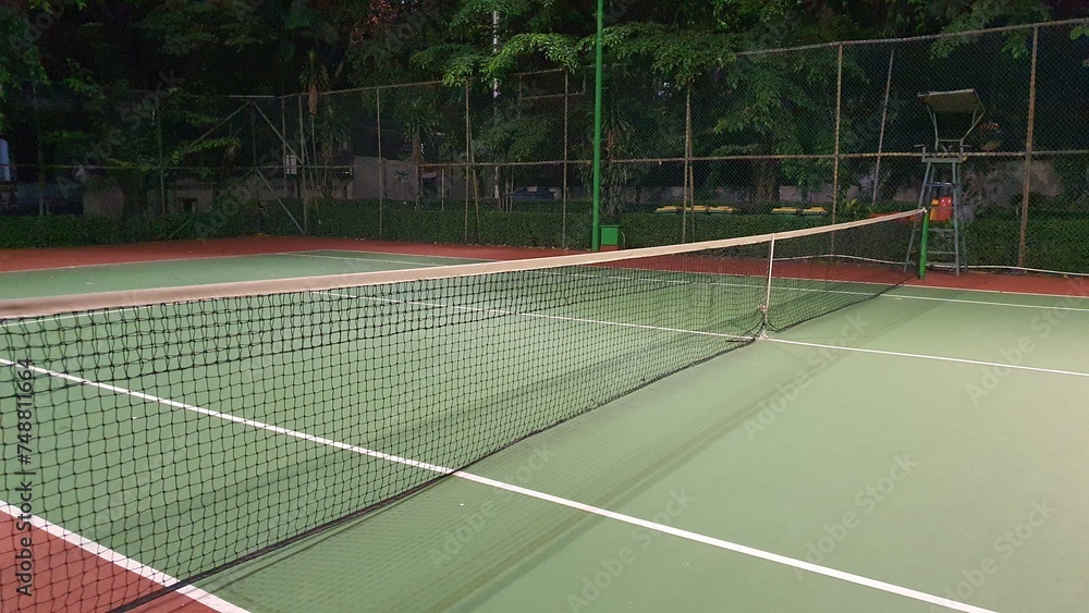 Tennis court and net at night