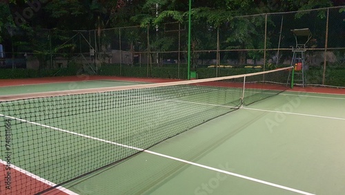 Tennis court and net at night