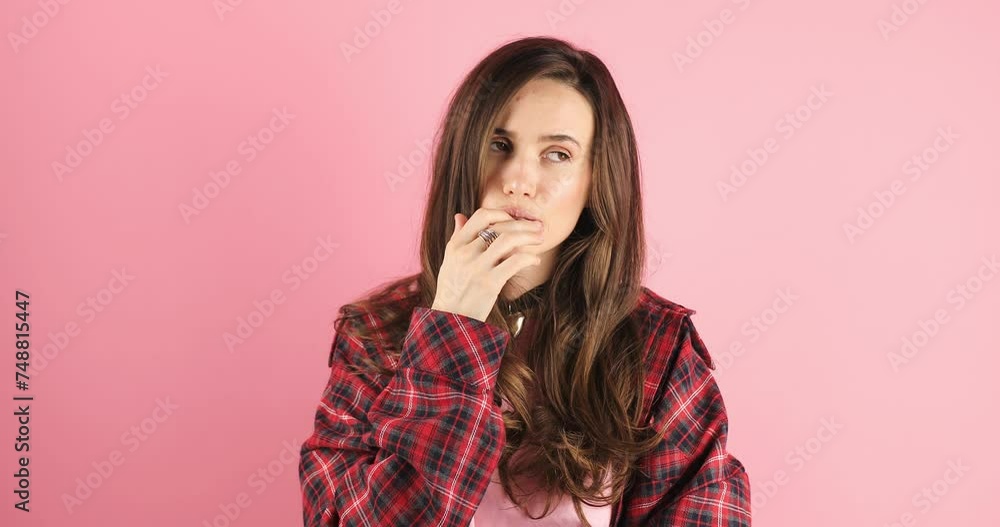 Need to think! Pensive doubting woman in red plaid shirt imagining in mind, wondering difficult solution, feeling confused, not sure about choice. Studio shot isolated on pink background. Need to think! Pensive doubting woman in red plaid shirt imagining in mind, wondering difficult solution, feeling confused, not sure about choice. Studio shot isolated on pink background.