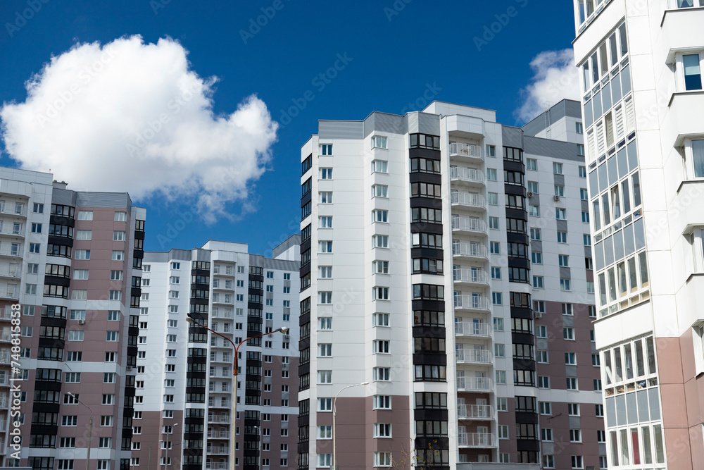 Modern residential area, houses on a sunny day. Exterior, facade of a residential building.