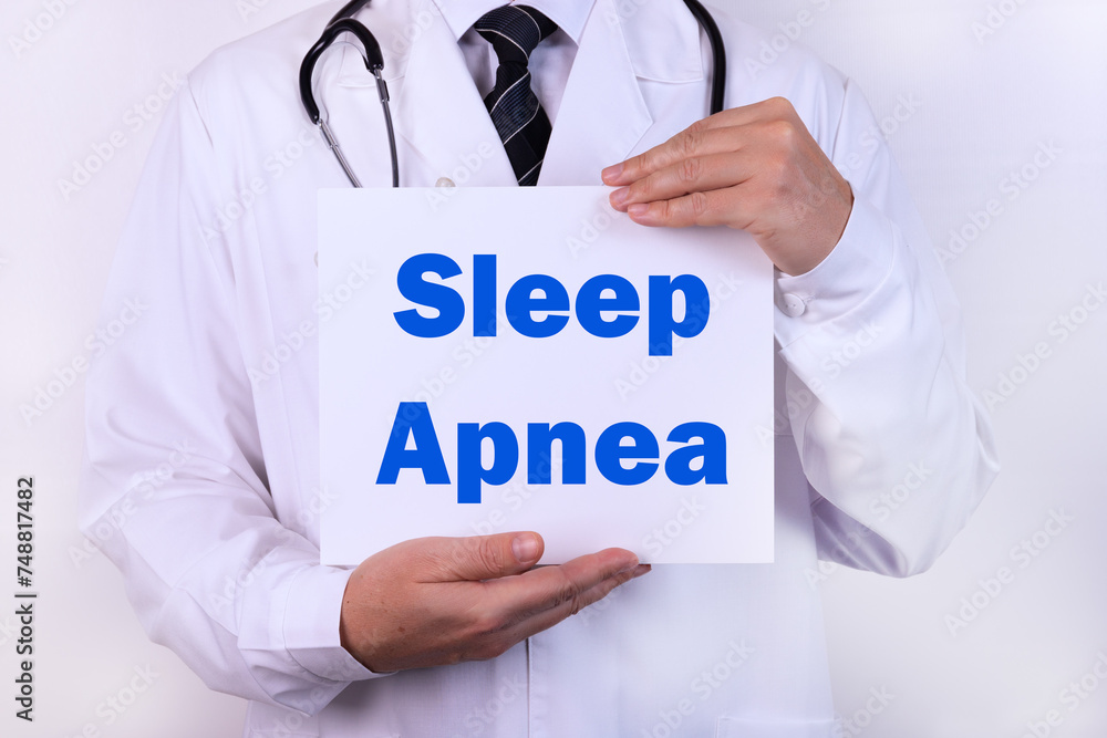 Doctor holding a card with Sleep Apnea medical concept Doctor holding a card with Sleep Apnea medical concept
