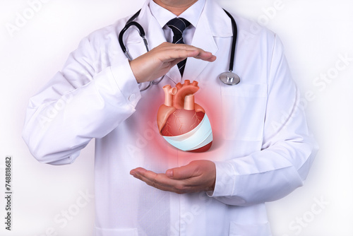 Protect health, healthcare and heart problems prevention, cardiology concept. Cardiologist with protective gesture and symbol of a sick heart. photo