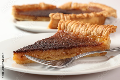 Shortcrust pastry with cider filling on plate. Cider Pie. Isolated on white background.