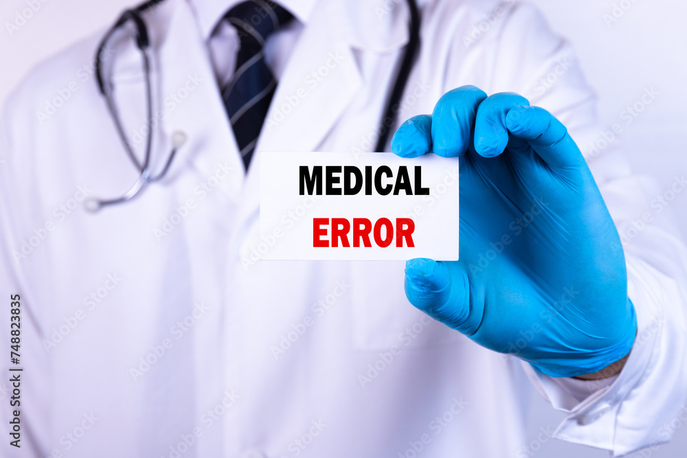 Doctor holding a card with text Medical Error medical concept Doctor holding a card with text Medical Error medical concept