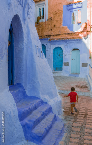 little kids playing on the old street