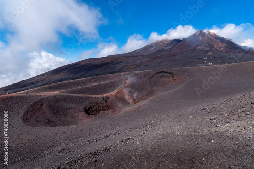 a trip to the Etna volcano with typical rock scenery 