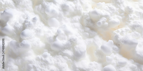 Close-up Texture of Whipped Egg Whites Forming Soft Peaks.