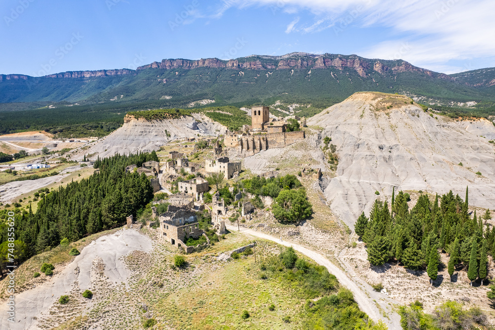 Aerial view of ruins of village of Escó by Yesa reservoir in Spain, Summer 2023