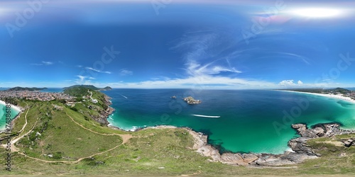 360 aerial photo taken with drone of end of peninsula with hiking trail from large beach