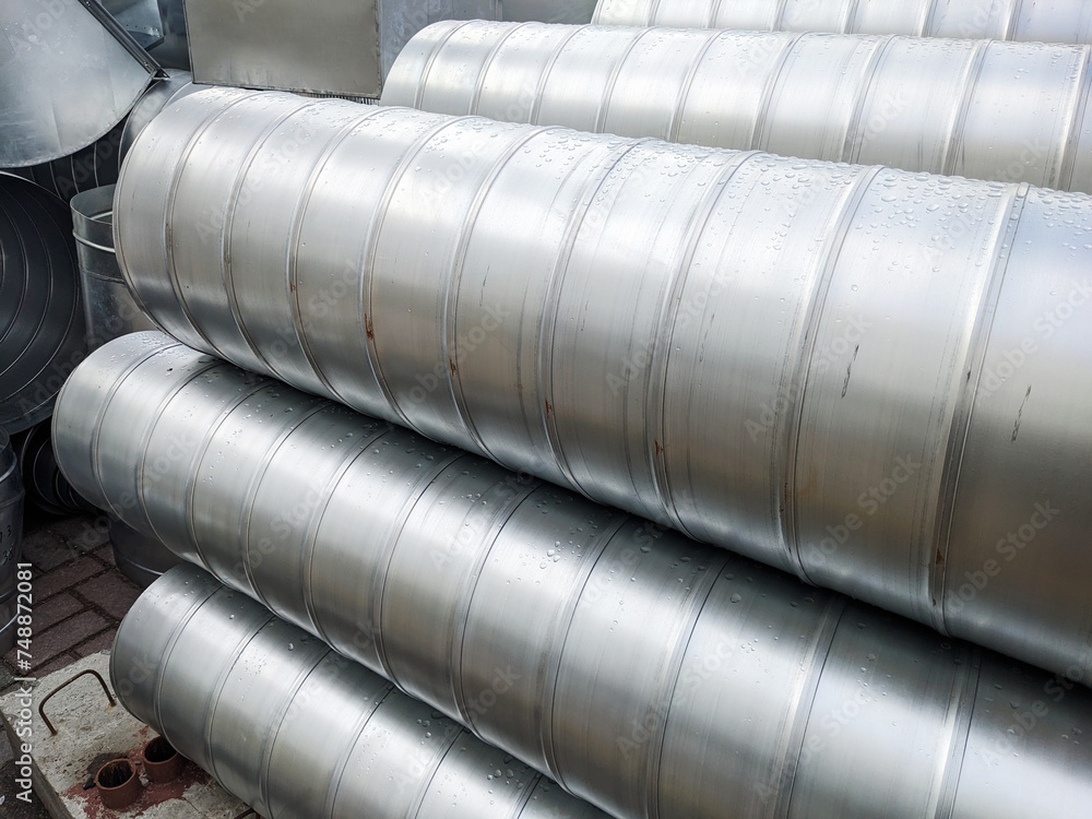 Piles of metallic pipes neatly stacked in a warehouse. Infrastructure Details Piles of metallic pipes neatly stacked in a warehouse. Infrastructure Details