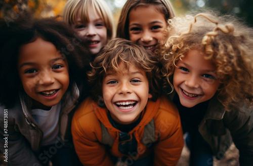 Happy African American boy and girl kids group playing in the playground in school. Children friendship and education concept.