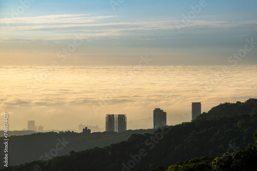 The sun  mountains and clouds create a wonderful symphony at dusk. Enjoy the sunset and sea of clouds. Zhongzhengshan Hiking Trail  Taipei City.