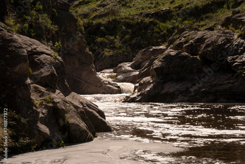 Panorama view of Yuspe river in the rock massif Los Gigantes in Cordoba, Argentina. View of the water flowing across the rocky hills.	
