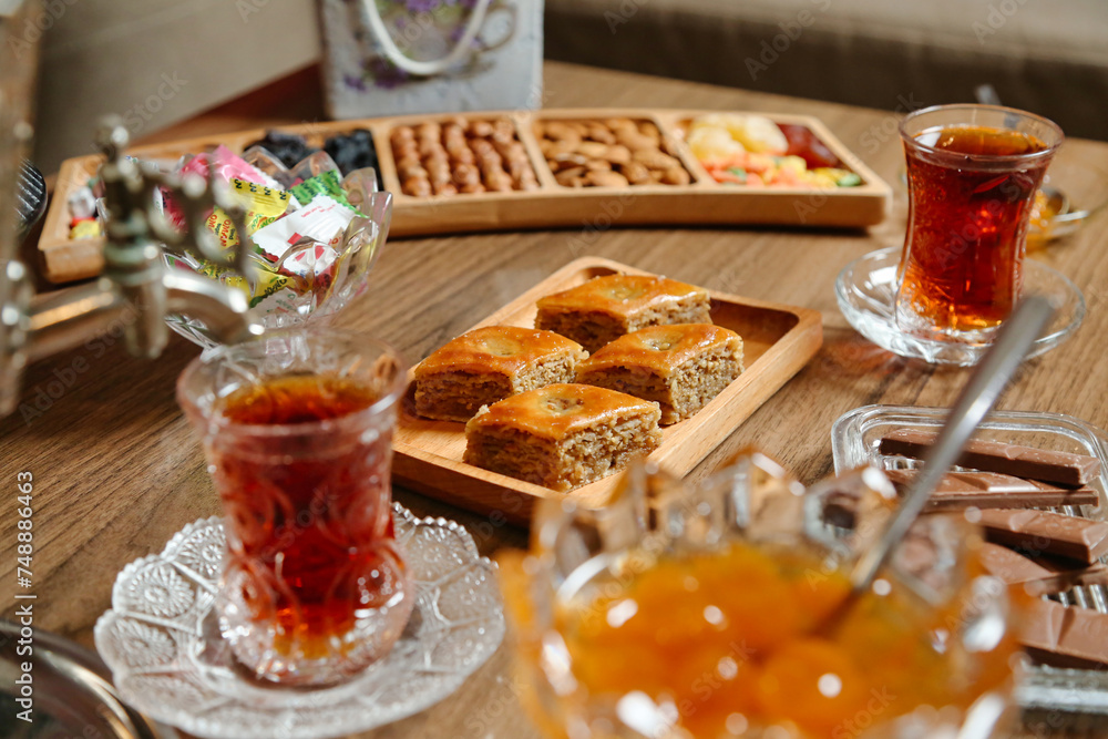 Wooden Table Adorned With Plates of Food and Drinks Wooden Table Adorned With Plates of Food and Drinks