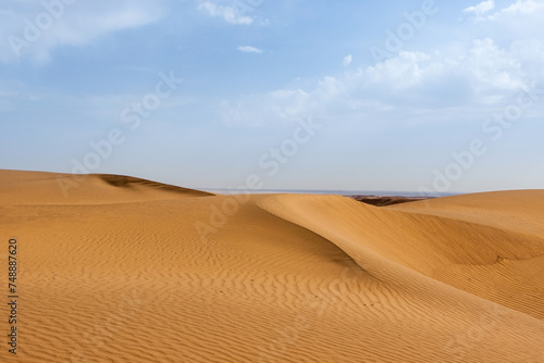 Sand dune in Kavir desert in Iran. Hot yellow deser landsape in south Iran.