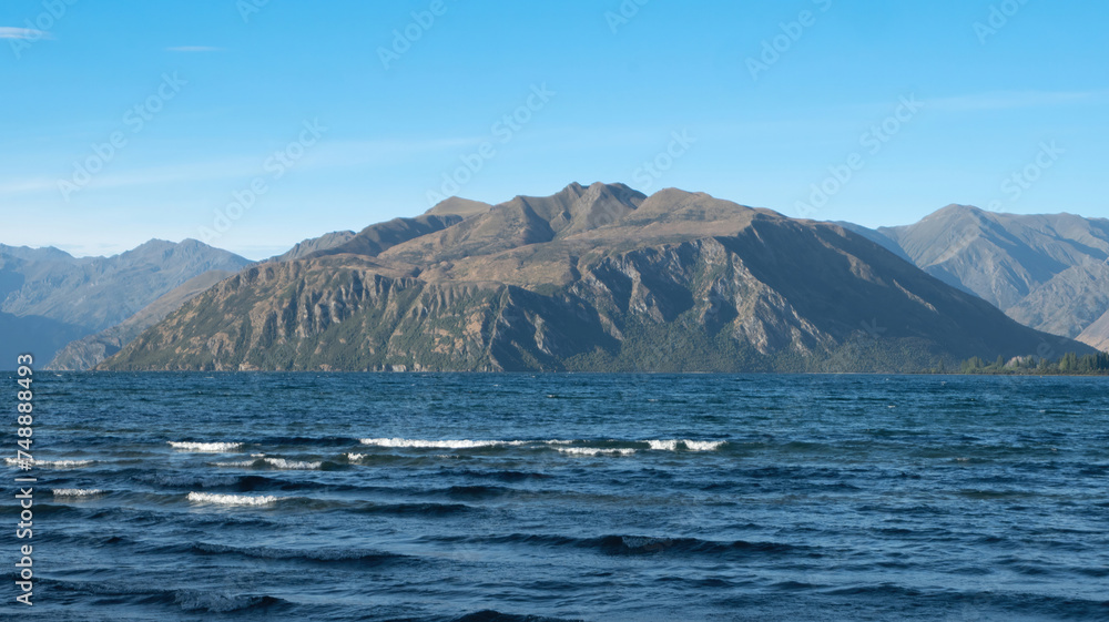 The peninsula of Lake Wanaka in the fresh morning of summer under a clear blue sky, Otago, New Zealand.