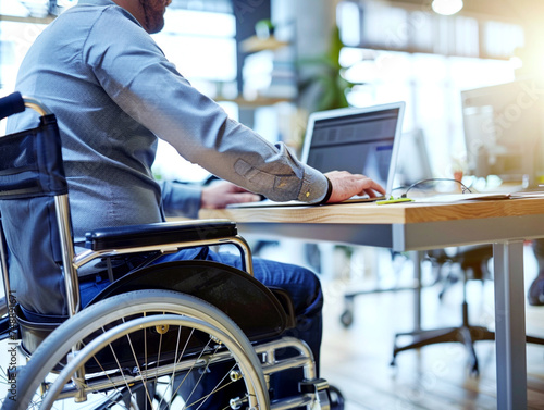 A person with a motor disability working in an inclusive workplace