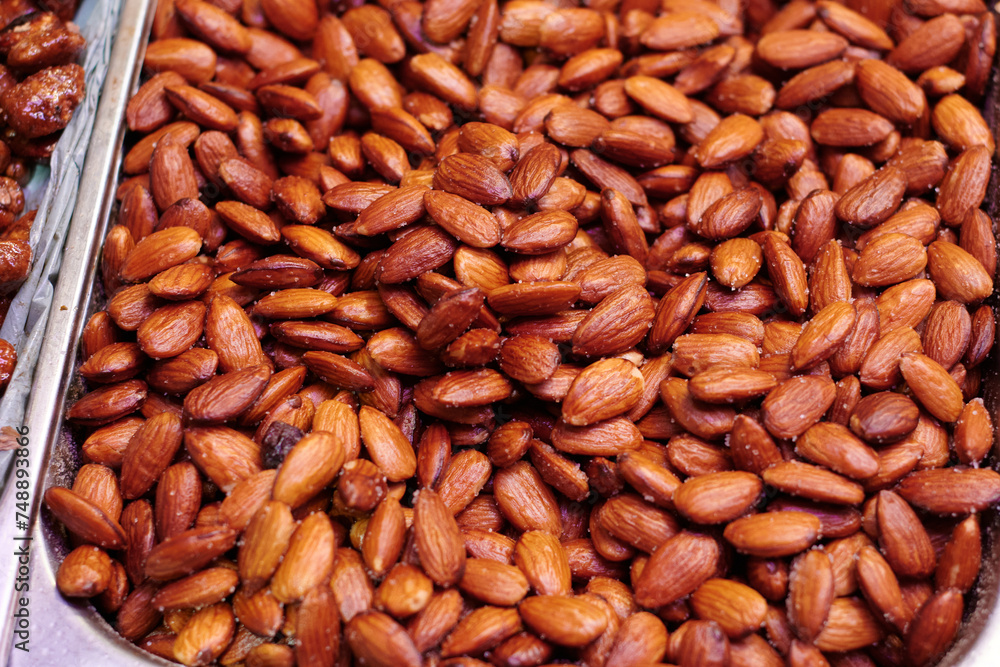 Salted and roasted almond skin. Tasty smoked nuts. Salted and roasted almond skin. Tasty smoked nuts.
