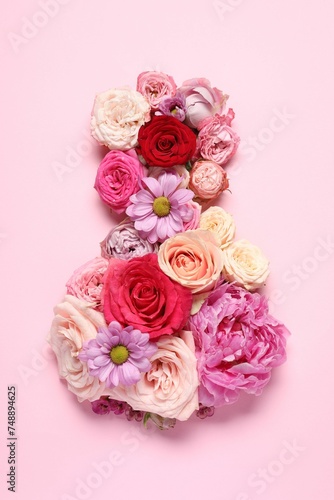 8 March greeting card design made with beautiful flowers on pink background  top view