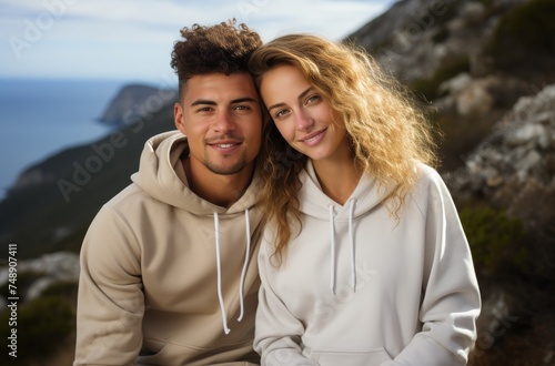 young couple posing outdoors in white hoodie product images