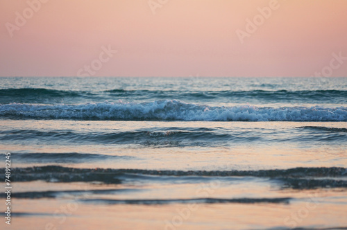 Beach and waves at sunset