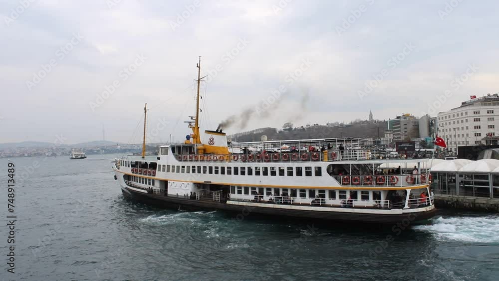 Ferry move to Eminönü terminal at morning time, view from other vessel departed from Europe side. Eminönü ,İstanbul Ferry move to Eminönü terminal at morning time, view from other vessel departed from Europe side. Eminönü ,İstanbul