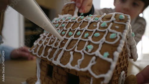 Artisanal gingerbread home decorated with royal ice. macro wide close-up of sugar bread decorative festivities photo