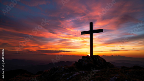 Christian cross silhouette at sunset. Mountain landscape. Easter wallpapers