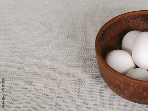 Chicken eggs in a clay bowl. Eggs to Easter