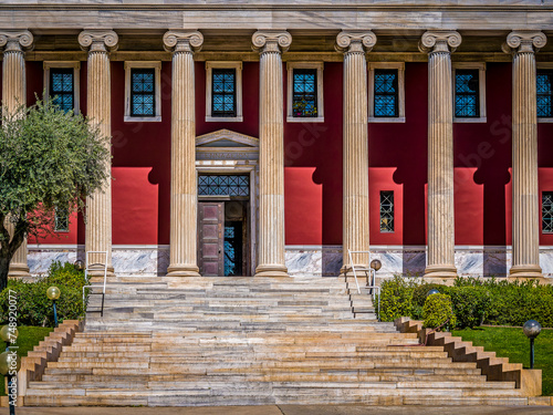 Partial view of the columns of Gennadius Library facade. .On the front is written a quote of Isocrates: "Greeks are called those who take part in our own education". Athens, Greece....