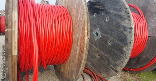 BIG High-voltage cable drum also called Electrical conductor reel with red cables photo