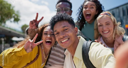 College student, friends and happy with selfie, hug and diversity at campus in summer with peace sign. Gen z group, women and men with emoji, solidarity or excited with social network at university photo