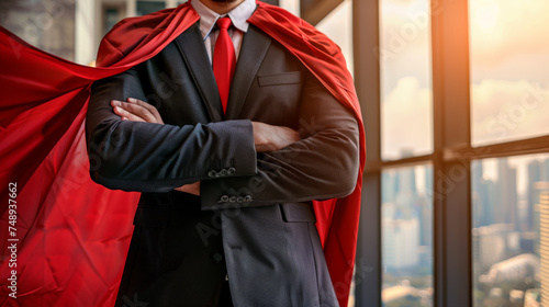 A person in a business suit with a red cape standing confidently with arms crossed in front of a city skyline, embodying the concept of a corporate superhero.