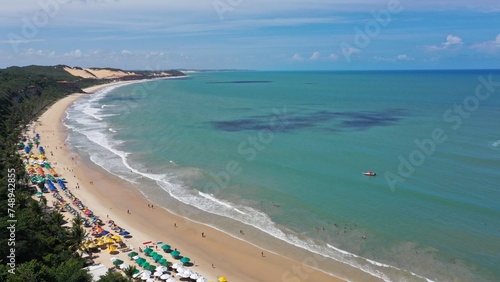 Aerial view of the calm and relaxing Madero beach with a private bay to swim with dolphins. Madero Beach  Natal  Rio Grande do Norte State in Brazil 
