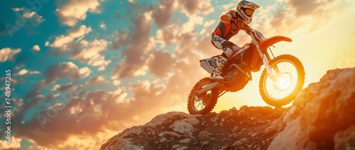 a person riding a motorcycle on a rocky hill