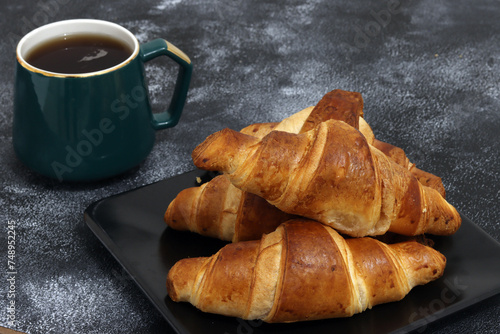 Freshly baked croissants, isolated on white background. 