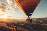 A couple flying in a hot air balloon with a basket and a view