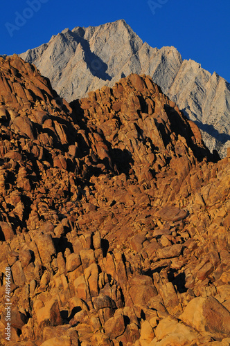 Sunrise on jagged Lone Pine Peak and the rock formations of the Alabama Hills National Scenic Area, Lone Pine, Eastern Sierra, California, USA.