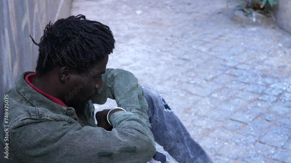 solidarity, help - young man brings comfort to a young immigrant solidarity, help - young man brings comfort to a young immigrant