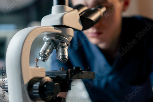 close up in a veterinary clinic a veterinarian doctor checks a smear for infections