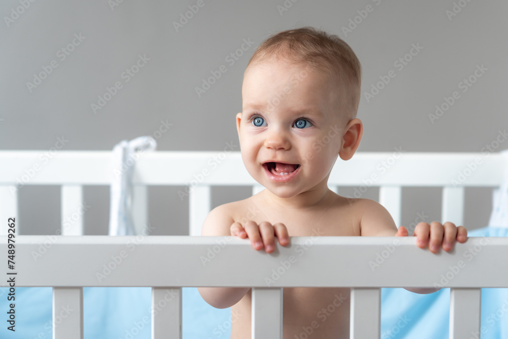 The baby stares with his mouth open in surprise The baby stares with his mouth open in surprise